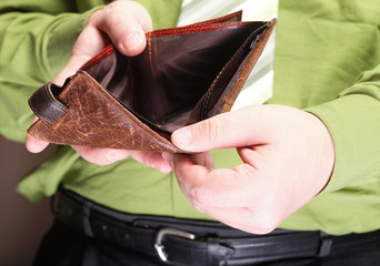 Empty wallet in male hands - poor economy