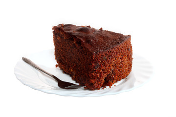 Piece of chocolate cake on white plate