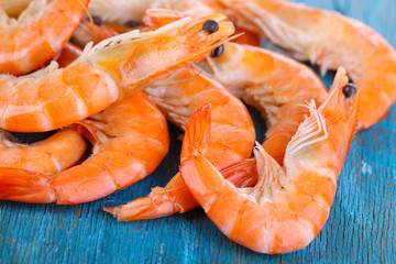 Shrimps on blue wooden table
