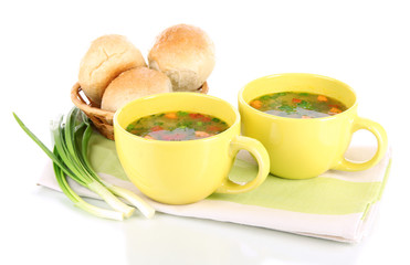 Fragrant soup in cups isolated on white