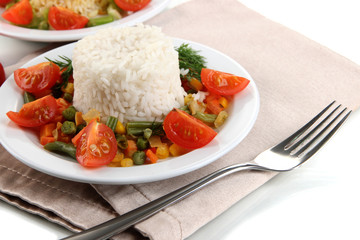 Delicious risotto with vegetables isolated on white