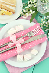 Table setting in white and pink tones
