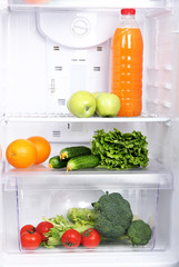 Open refrigerator with vegetarian (diet) food © Africa Studio