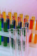 Empty and colorful test tubes close-up