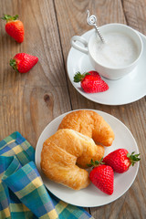 Breakfast with coffee and fresh croissants