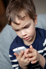 Portrait of boy with mobile phone