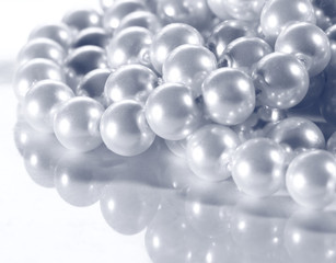 White pearl on reflective surface