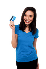 Smiling asian girl showing cash card