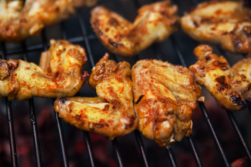 Buffalo wings cooked on grill
