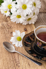 Fototapeta na wymiar Herbata ziołowa z kwiatów rumianku