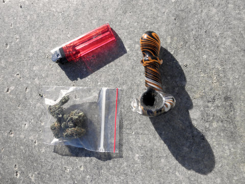 Bag of Medical Marijuana, Pipe and lighter sitting