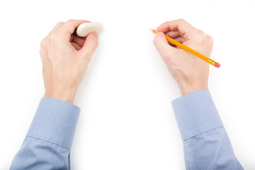 Man holding pencil and eraser