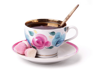 A cup of tea with sweets - 51465391