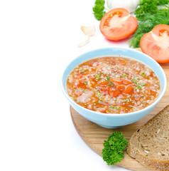 bowl of tomato soup with buckwheat isolated