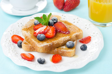 crispy toast with honey and fresh berries for breakfast