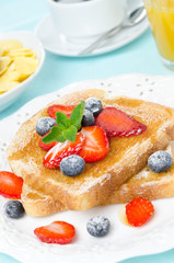 crispy toast with honey, fresh berries, cup of coffee