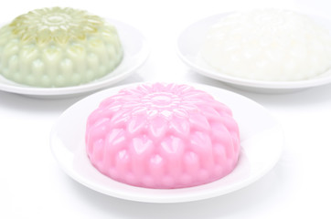 different types of Panna cotta (raspberry, tea matcha, vanilla)