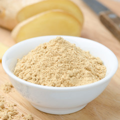 dried ginger in white bowl closeup