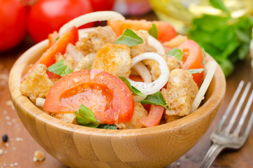 Italian salad panzanella with tomatoes, onions, croutons