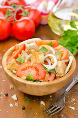 Italian salad panzanella with tomatoes, onions and croutons