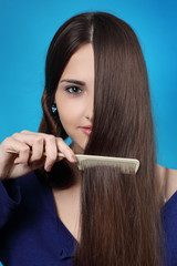 Obraz premium girl combs long hair