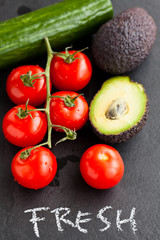 Obraz na płótnie Canvas Fresh tomatoes and avocados and cucumber