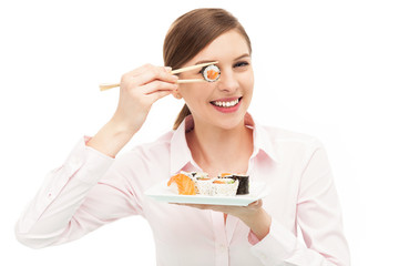 Beautiful woman eating sushi