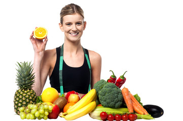 Obraz premium The beautiful girl with fruits and vegetables