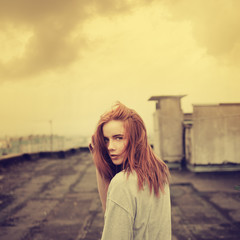 beautiful girl on the roof. vintage photos in yellow