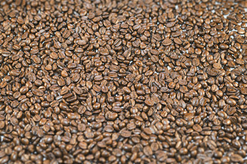 Surface covered with roasted coffee beans