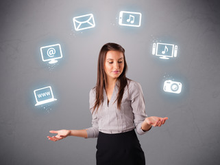 pretty girl juggling with elecrtonic devices icons