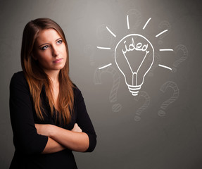 Young girl comming up with a light bubl idea sign