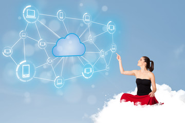 Happy woman sitting on cloud with cloud computing