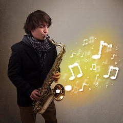 Handsome musician playing on saxophone with musical notes