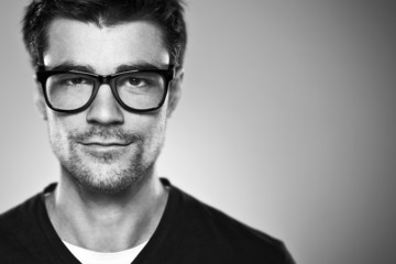 Portrait of a normal boy with rimmed glasses