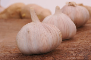Fresh garlic on a wooden background