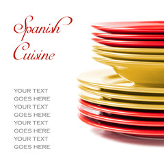 Plates in yellow and, illustrating Spanish couisine