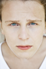 Portrait of a young guy with blue eyes