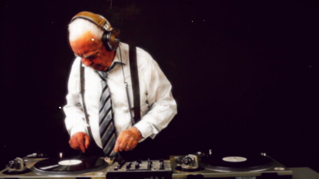 very funky elderly grandpa dj mixing records