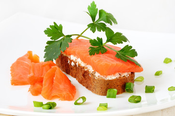 Sandwich with salmon and parsley
