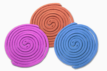 Three mosquito repellent incense coil isolated on white backgrou