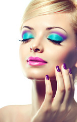 Blonde model with fashion make-up and violet manicure