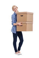 Smiling woman carrying two boxes