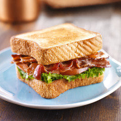 BLT bacon lettuce tomato sandwich on blue plate