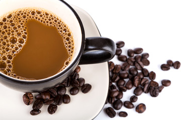 Coffee cup and beans on a white background
