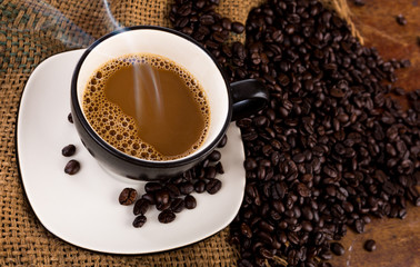 Coffee cup and beans
