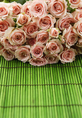 Big bouquet rose on green mat