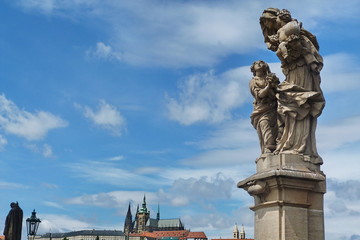 Fototapeta na wymiar Group of statues on Charles Bridge in Prague, Czech Republic