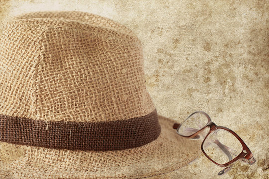 Summer straw hat with glasses, photo in old image style