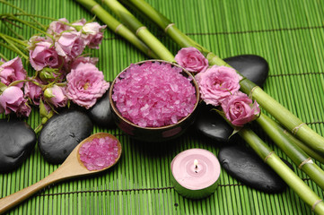 orchid with salt in bowl and candle ,grove on green mat